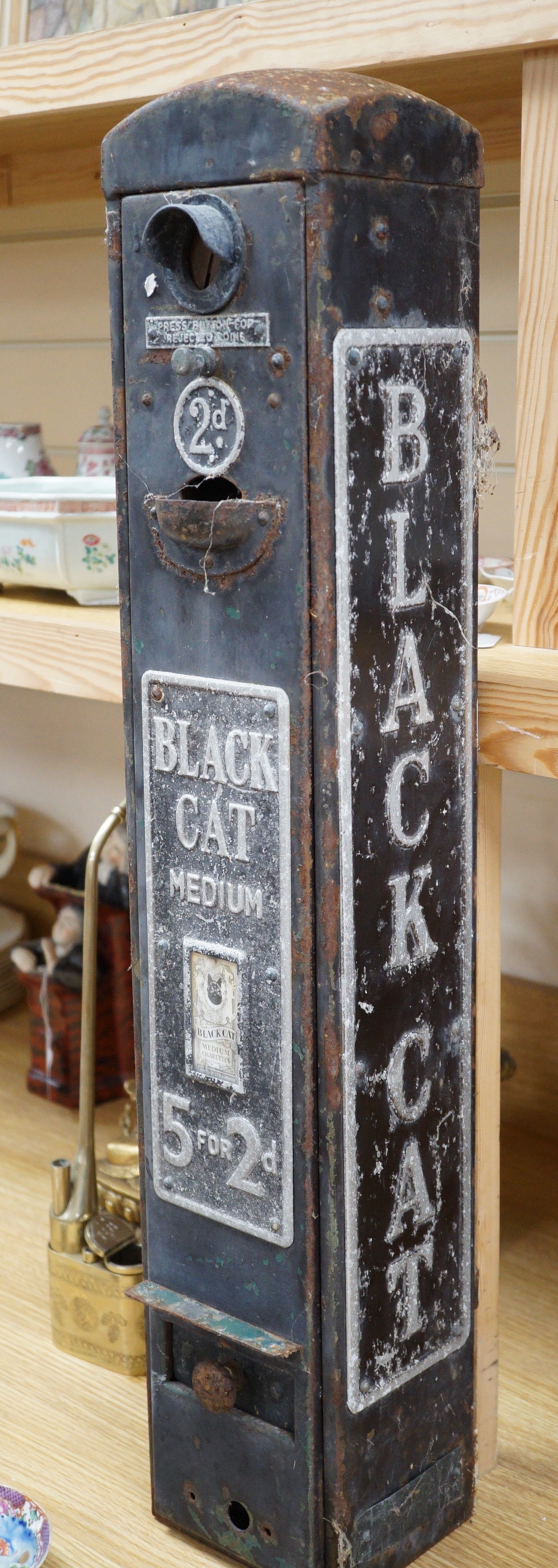 A Black Cat cigarette vending machine, 76cm